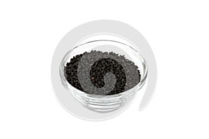 Black onion seeds in glass bowl
