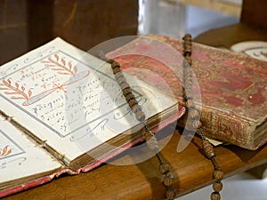 Black onyx beads rosary on the old Bible.