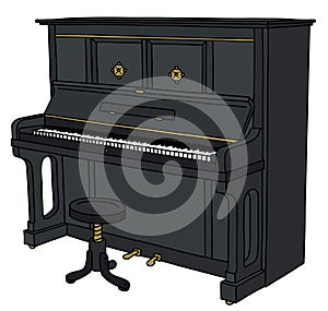 The black opened pianino with a chair