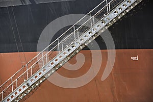 Black orange Iron Ore Carrier with lowered gangway