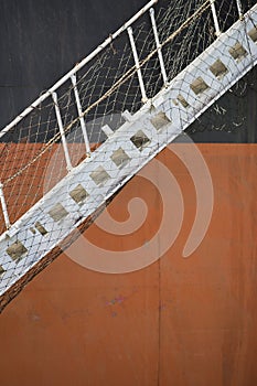Black orange Iron Ore Carrier with lowered gangway