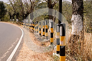 black orange roadblocks signify sharp bends and ravines photo