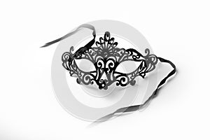 Black Ornate Masquerade Mask on White Background photo