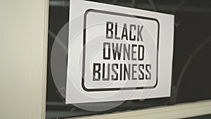 Black owned business sign were attached in front of the shop
