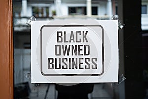 Black owned business sign on the window