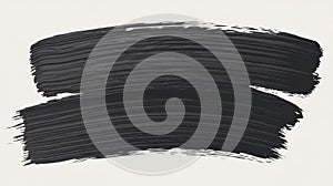 Black paint strokes on a light background, creating a bold artistic statement.