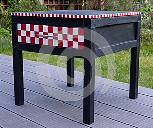 Black painted bedside table with drawer that has been upcycled and painted in Annie Sloan chalk paint.