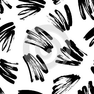 Black painted brush strokes seamless vector pattern. Black brushstrokes on a white background.