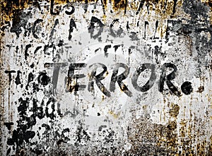 Black painted rustic terror text/word on rusty and weathered destroyed concrete wall background.