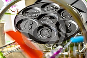 Black pancake smile frying pan on plate drainer rack in kitchen