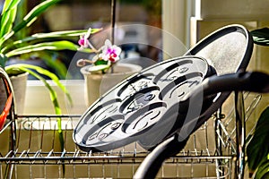 Black pancake smile frying pan on plate drainer rack in kitchen