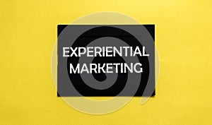 Black pancel write a text Experiential Marketing on the yellow