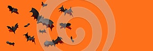 Black paper bats orange background Halloween banner