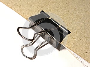 Black paper clip with stainless steel handle