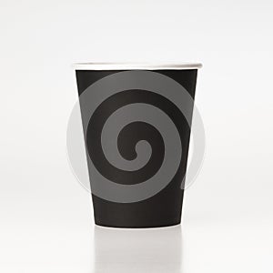 Black paper coffee cup on white background