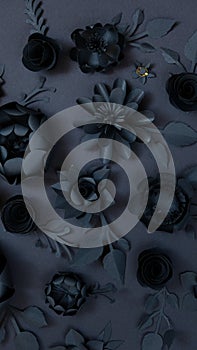 Black paper flowers on Black background. Cut from paper