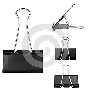 Black paperclips on white background