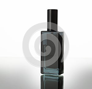 Black parfum bottle isolated on white