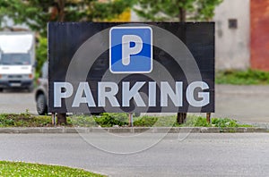 Black parking sign straight ahead