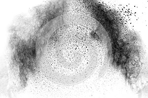 Black particles splatter on white background. Black powder dust burst