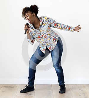 Black passionate woman vocalist singing karaoke