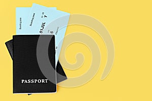 Black passports, flight boarding pass, airline tickets, airplane travel concept, summer holidays, vacation, international tourism
