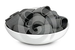 Black pasta with cuttlefish ink in ceranic bowl isolated on white background