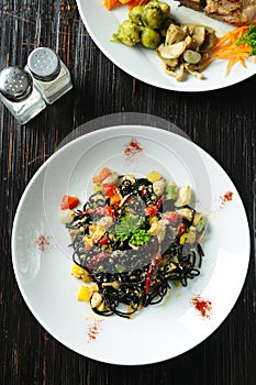 Black pasta with vegetable