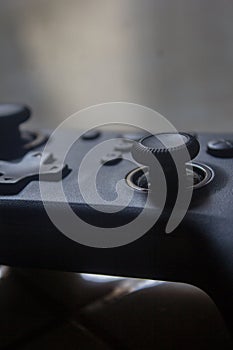 Black PC Gamepad Controller Lying on Desk Minimalist Gaming Setup