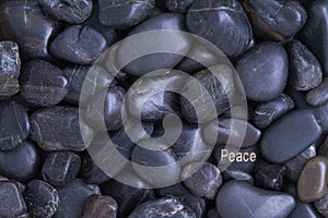 Black pebble background with a Peace theme