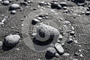 Black pebbles on a black beach on Lanzarote, Canary Islands.