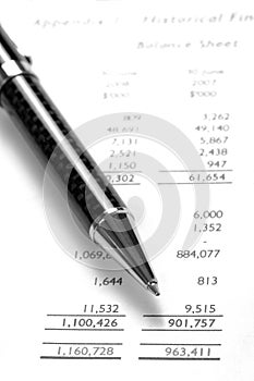 Black Pen On Financial Balance Sheet