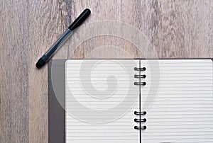 Black pen and note pad diary