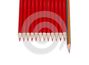 Black pencil standing out from the red pencils, isolated