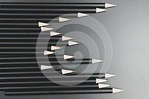 Black pencils on the matte black background