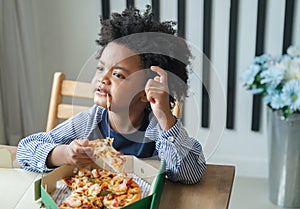 Black people African American child eat pizza on table