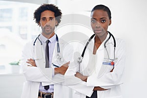 Black people, portrait and doctors with arms crossed for healthcare, confidence in medicine and team at hospital