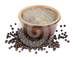Black pepper in bowl isolated on white background
