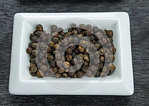 Black pepper. Colorful spices in white bowls Seasonings for cooking. Natural Herbs