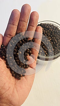 black pepper in hand