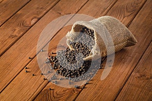 Black pepper peas on sacking material background