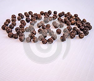 Black pepper whole peppercorn seeds grains kali mirch hot indian spice natural food ingredient closeup view image stock photo