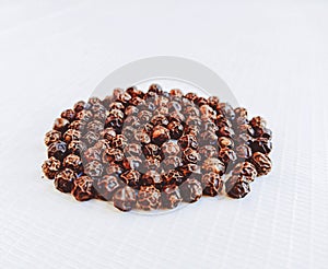 Black pepper whole peppercorn seeds grains kali mirch hot indian spice natural food ingredient closeup view image stock photo