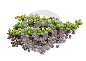 Black peppercorn and Bunches of fresh green pepper