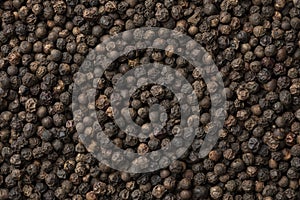Black peppercorns close up full frame