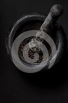 Black peppercorns mortar