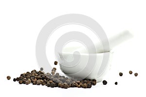 Black peppercorns with mortar