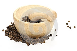 Black peppercorns with mortar