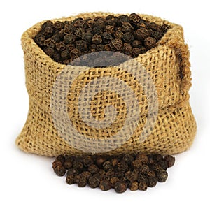 Black peppercorns in sack