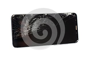 Black phone with a broken sensor and screen, cracked touchscreen glass on a white background isloate